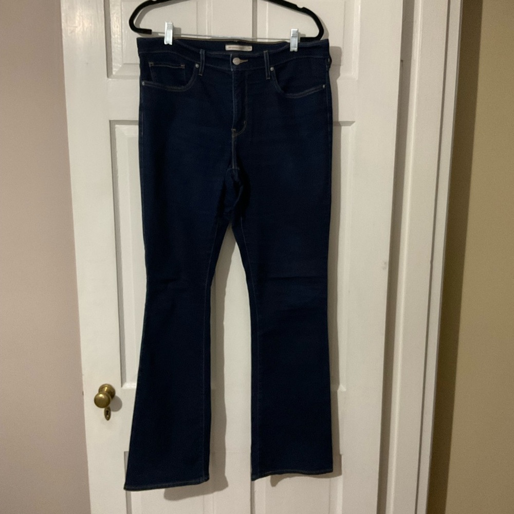 Dark blue Levi’s bootcut jeans. 33” waist
